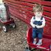 Fourteen-month-old Alex Smith from Dexter stands on a wagon at the Cobblestone Farm Farmers Market on Tuesday, May 21. Daniel Brenner I AnnArbor.com